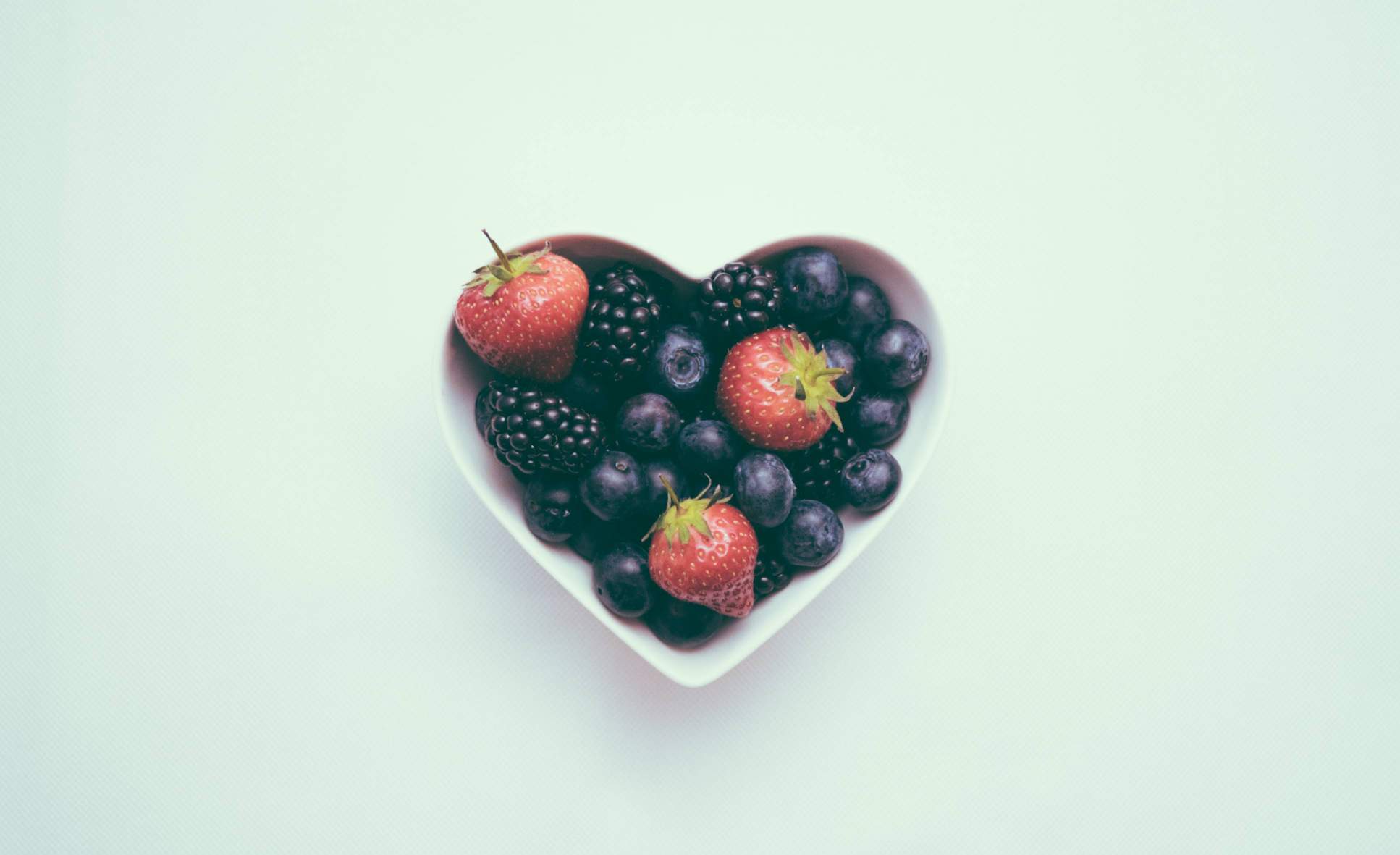 berries in a heart shaped bowl